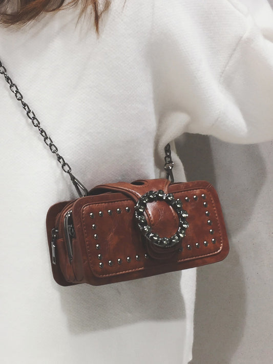 Square bag with studs and buckles